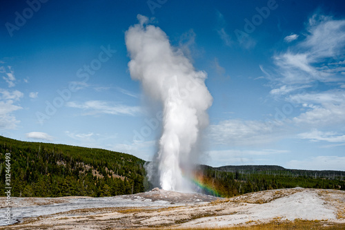 Old Faithful Geyser and the landscape nature in Yellowstone national park in Wyoming , United States of America