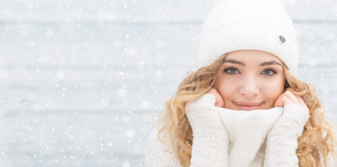 Portrait of young beautiful woman in winter clothes