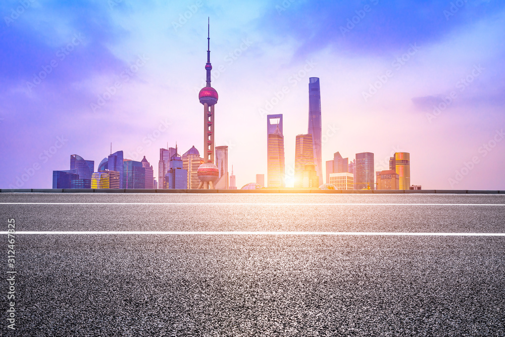 Fototapeta premium Night empty asphalt road and beautiful cityscape in Shanghai