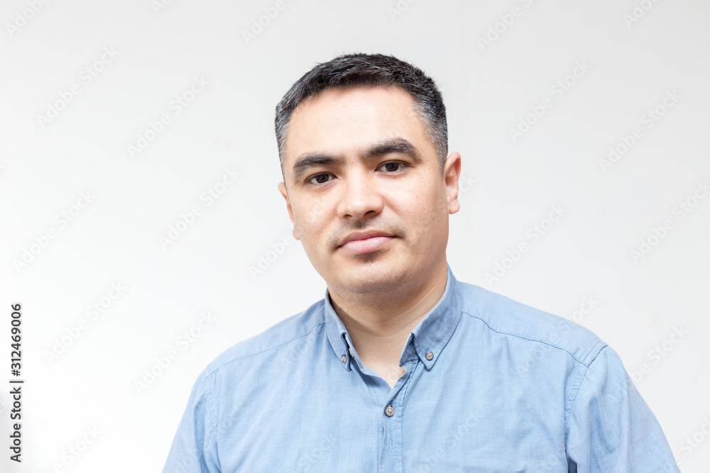 Attractive handsome smiling positive happy business man. Closeup portrait of a polite middle age man wearing a blue shirt Attractive handsome smiling positive happy business man. Closeup portrait of a polite middle age man wearing a blue shirt