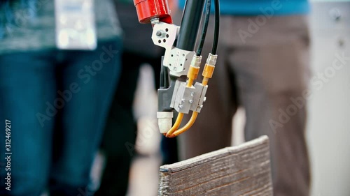 Wallpaper Mural An industrial machine analysing a detail on exhibition of innovative machines Torontodigital.ca