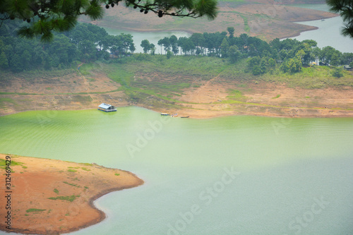 Barapani or Umiam Lake of  Shillong, Meghalaya as seen fron the view point on the road with water, trees and natural beauty, selective focusing photo