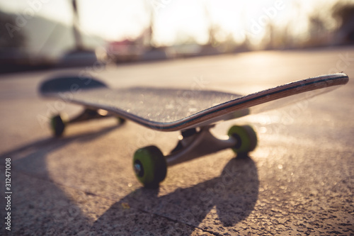 Skateboard ready for riding at sunrise park