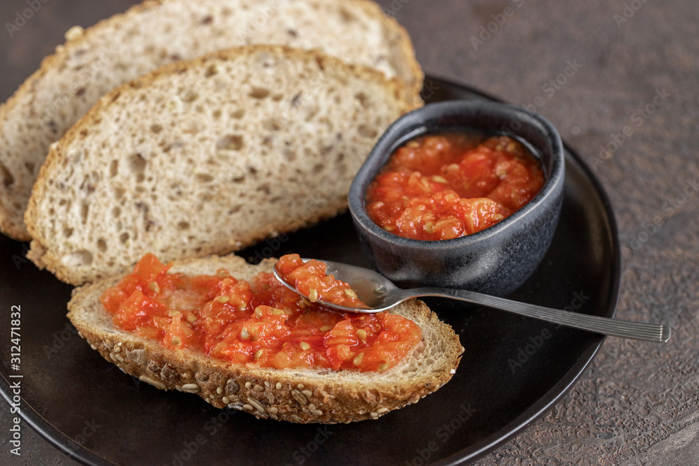 a amb tomaquet or tomaca or pan con tomate (bread with tomato) classic snack in Catalan and Spanish cuisine, eaten for breakfast.