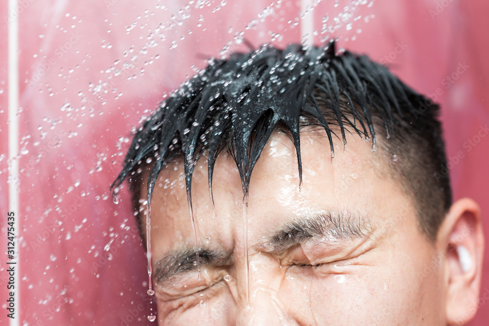 Asian handsome young man bathing in bathroom Asian handsome young man bathing in bathroom