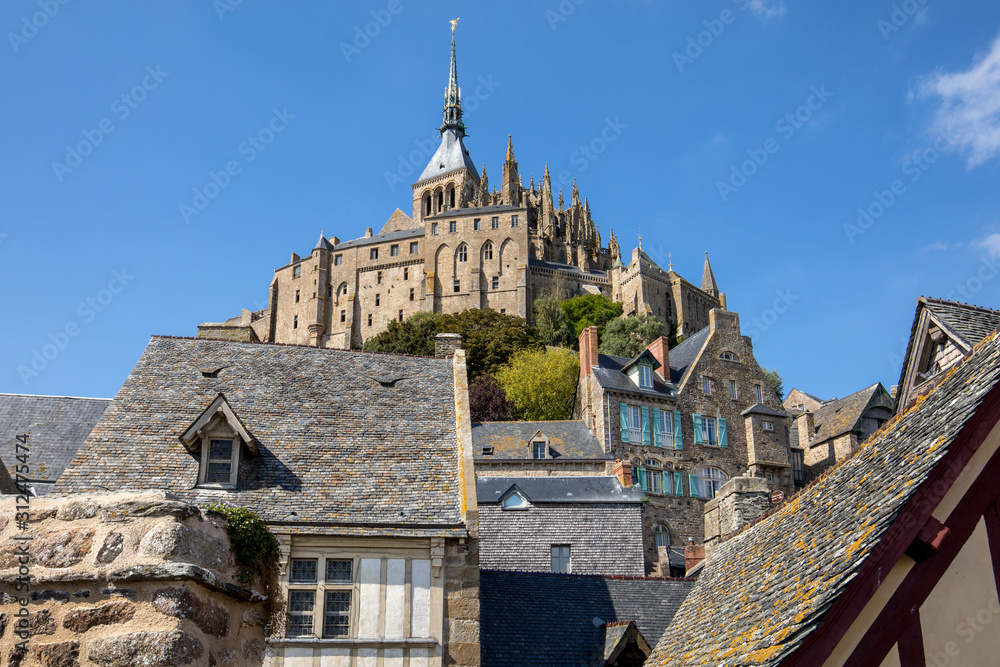 Fototapeta premium Ancient buildings of the old town on the famous Mont Saint Michel island in France