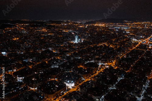 Basilica in Barcelona Spain Night view with authentic street view and houses between roads