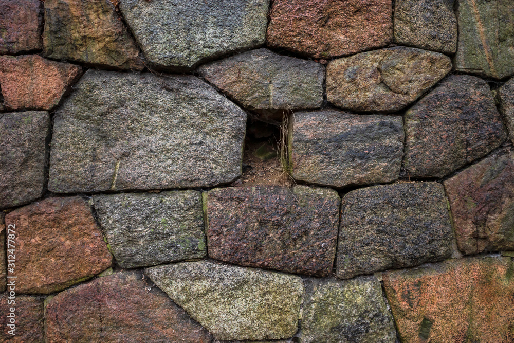 Wall of an old fortress made of large hewn stones Wall of an old fortress made of large hewn stones