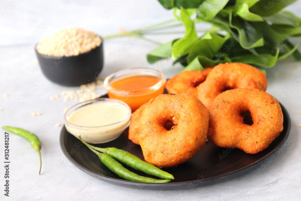 Vada or Medu vadai with sambar and coconut chutney - Popular South Indian snack. recipe ingredients with Copy space