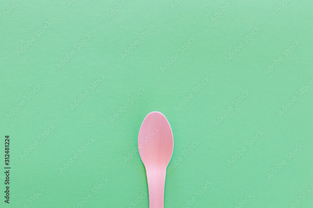 Spoon Cutlery on a bright green background. Eco-friendly wooden ...