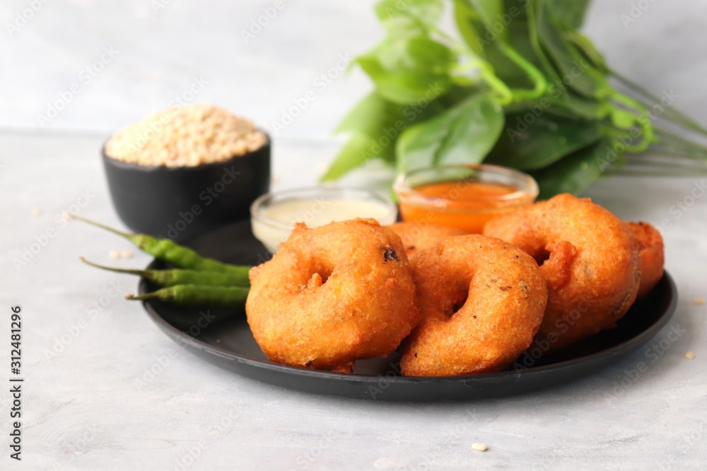 Vada or Medu vadai with sambar and coconut chutney - Popular South Indian snack. recipe ingredients with Copy space
