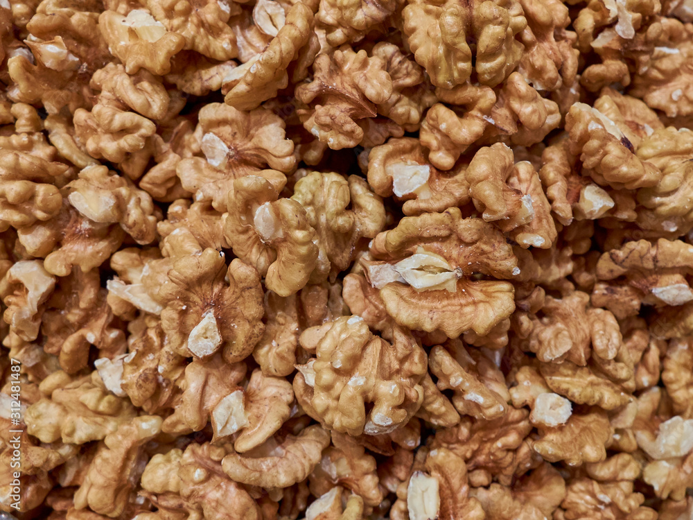 Raw walnut kernels background texture or concept Raw walnut kernels background texture or concept