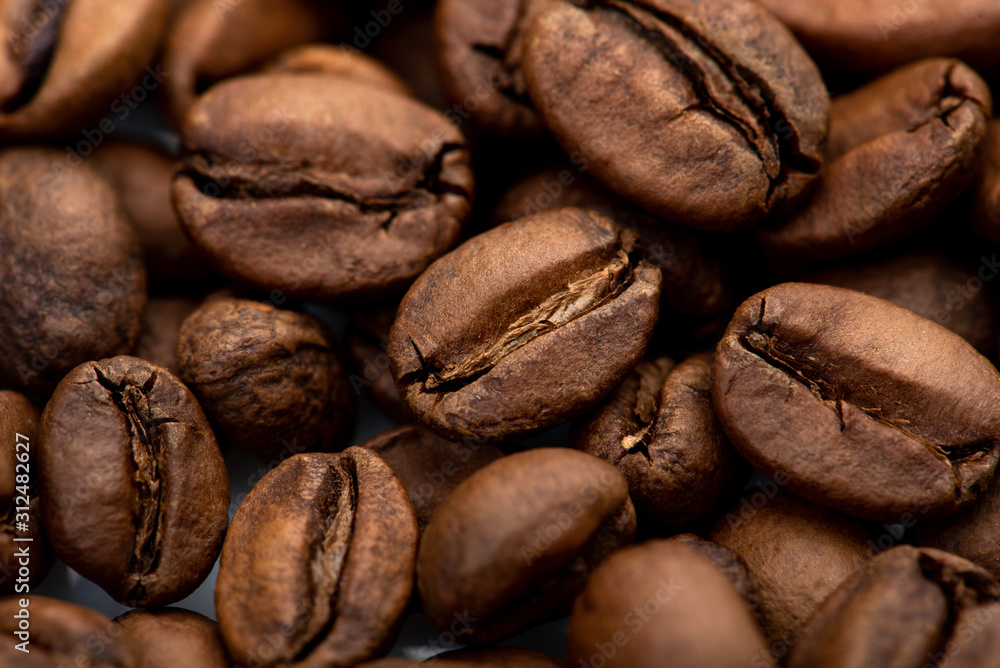 Fototapeta premium Coffee beans close-up background. Fresh roasted