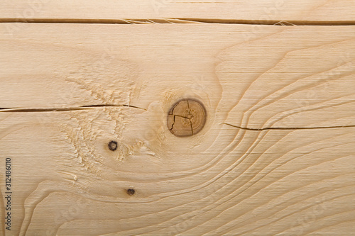 The surface of the processed wooden beam close-up.
