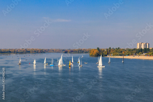 Yachts at sailing regatta on the Dnieper river in Kremenchug, Ukraine