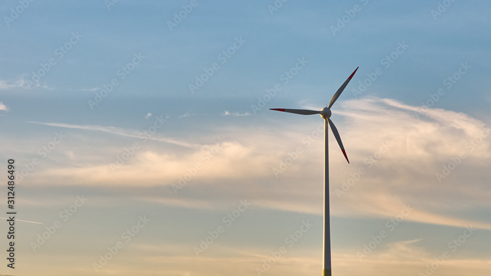 wind generator against the evening sky wind generator against the evening sky