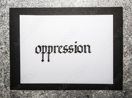 Handwritten word Oppression. Gothic script calligraphy.