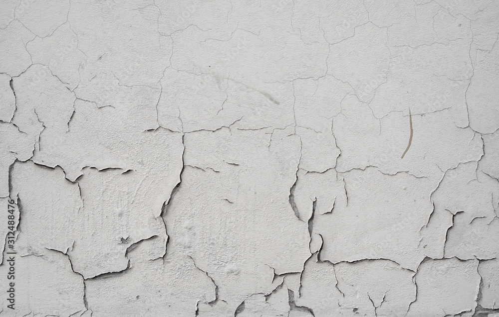 Cracked concrete grey wall covered with gray cement texture as background can be used in design. Dirty concrete texture with cracks and holes. Cracked concrete grey wall covered with gray cement texture as background can be used in design. Dirty concrete texture with cracks and holes.