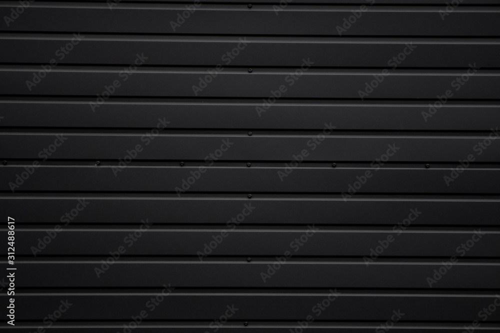 Black Corrugated metal sheet texture surface of the wall. Galvanize steel background.