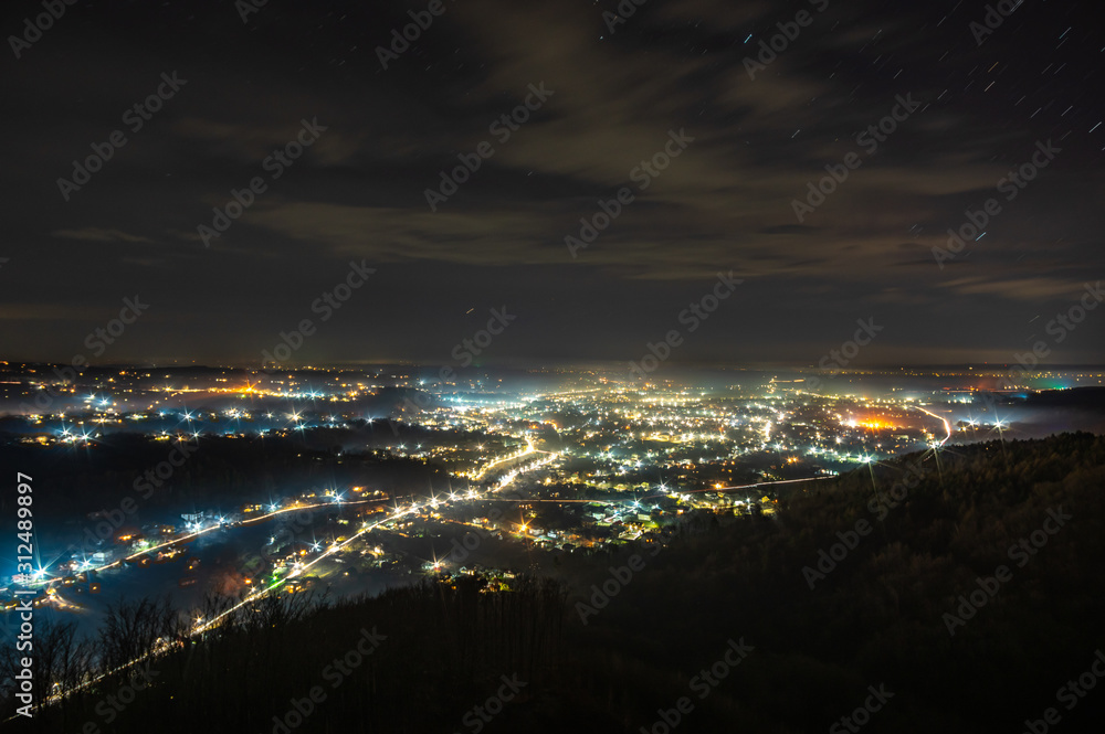 Obraz premium View of the night Ukrainian city in the fog