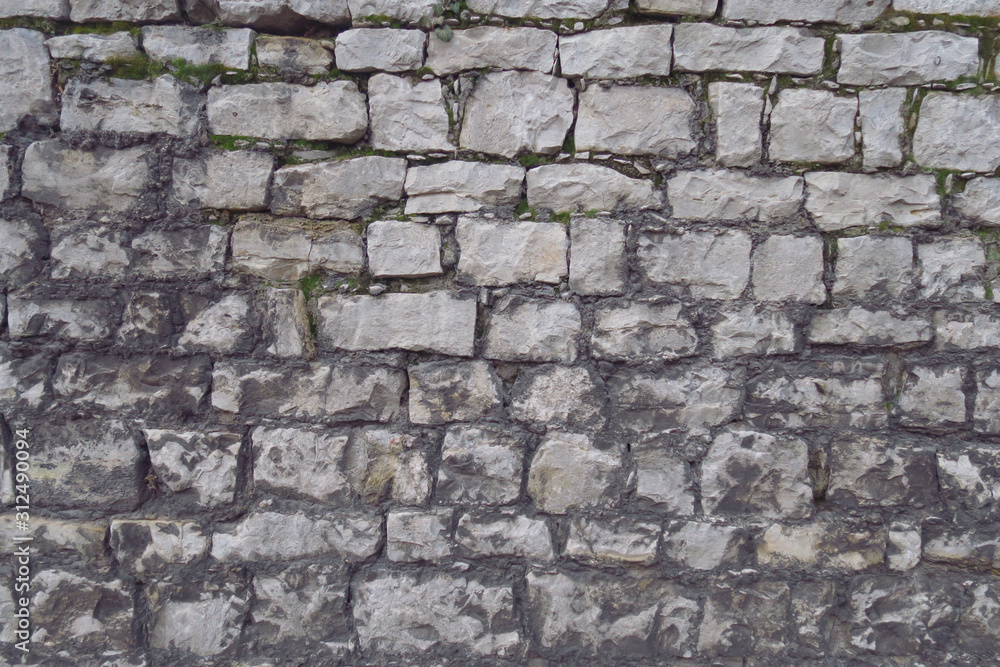 Fototapeta premium Antike, alte Steinmauer als Hintergrund