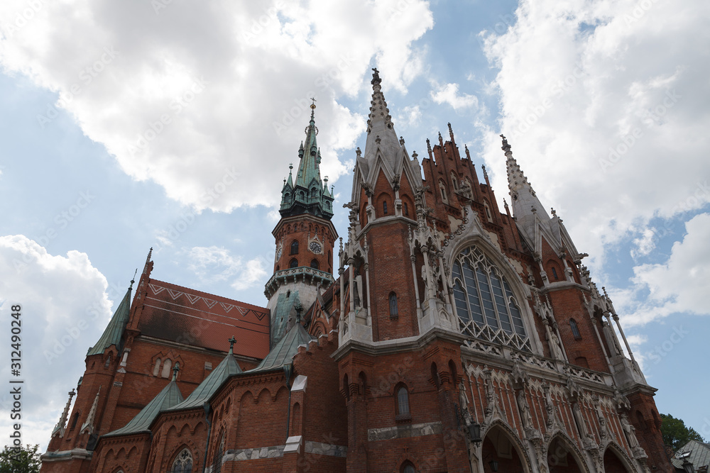Fototapeta premium St. Joseph's Church built from red brick. Gothic architecture in Krakow, Poland.