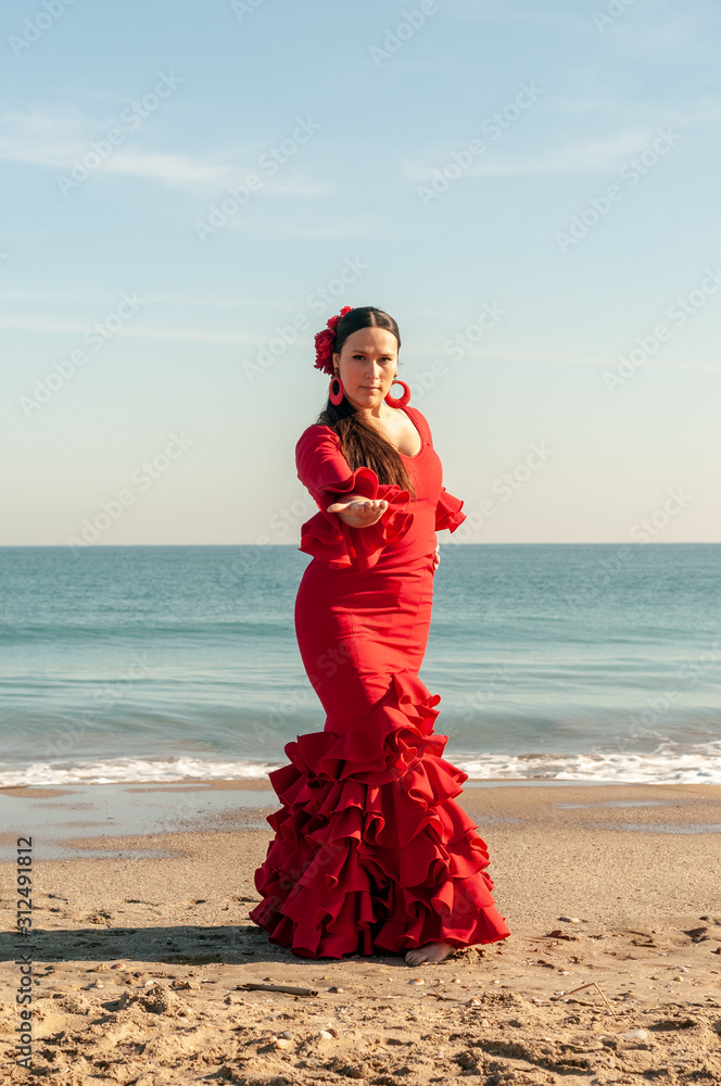Young Spanish woman dancing flamenco on the beach Young Spanish woman dancing flamenco on the beach