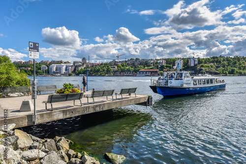 Commuter ferry of Stockholm approaching Blockhusudden stop in Djurgarden island. . photo