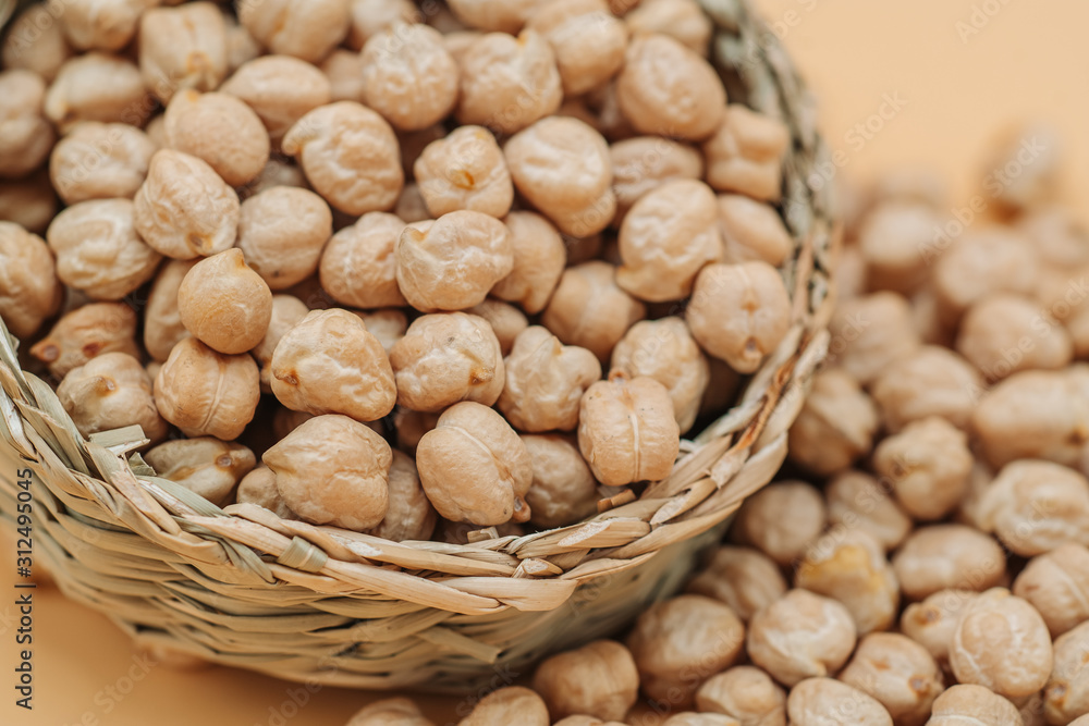Healthy organic dried chickpeas in a straw basket Healthy organic dried chickpeas in a straw basket