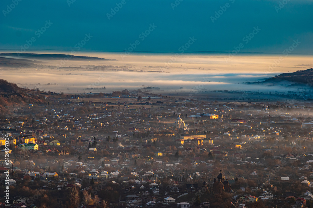 Morning city in the fog