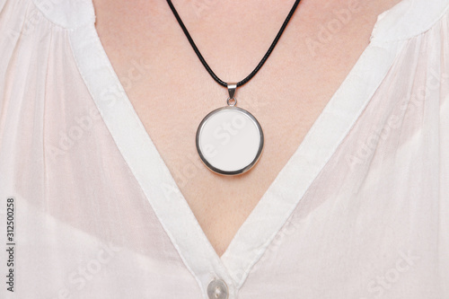 Round Pendant with black cord, on the neck of a woman, product mock up