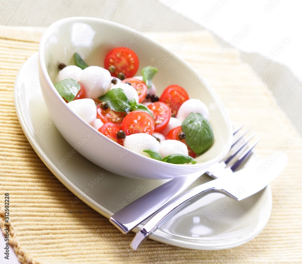 Close of tomato and mozarella in dish Close of tomato and mozarella in dish