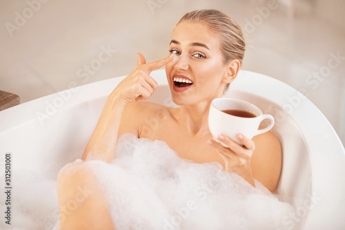 Happy young woman relaxing ...