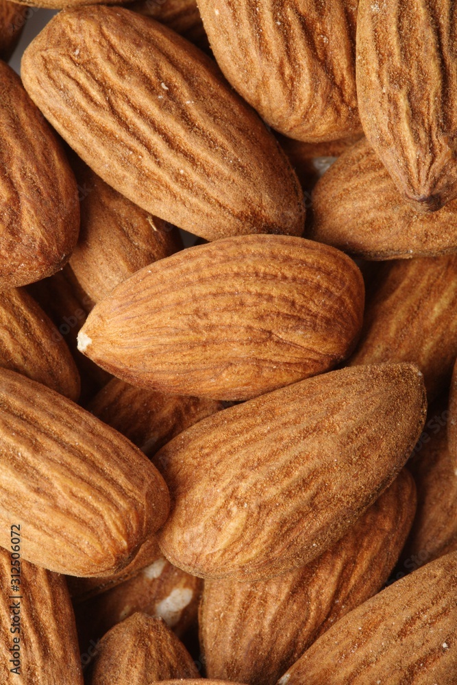 Almonds on white background - close-up Almonds on white background - close-up