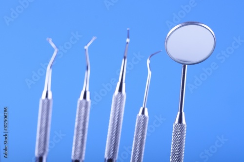 Dentistic tools on blue bacground
