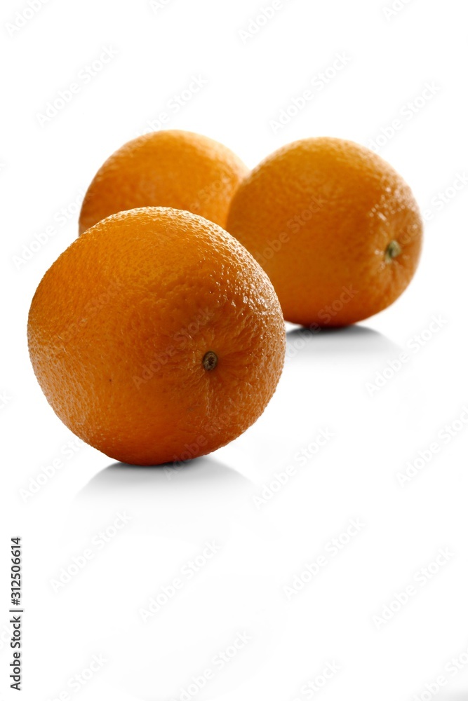 Oranges on white background - close-up Oranges on white background - close-up