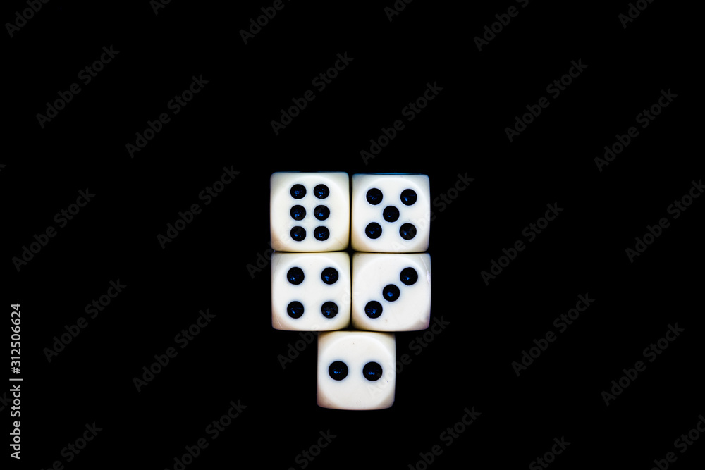 five dices on a black background ready for starting the games five dices on a black background ready for starting the games