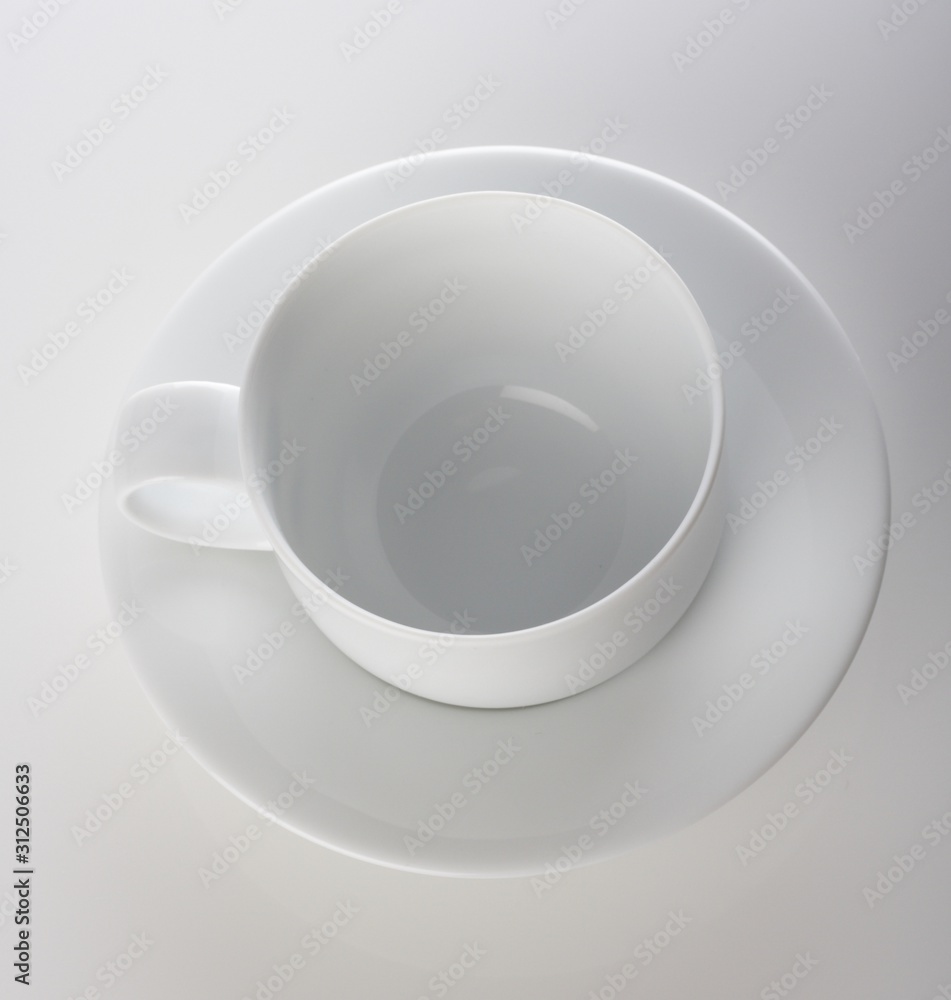 Empty cup on white background - studio shot Empty cup on white background - studio shot
