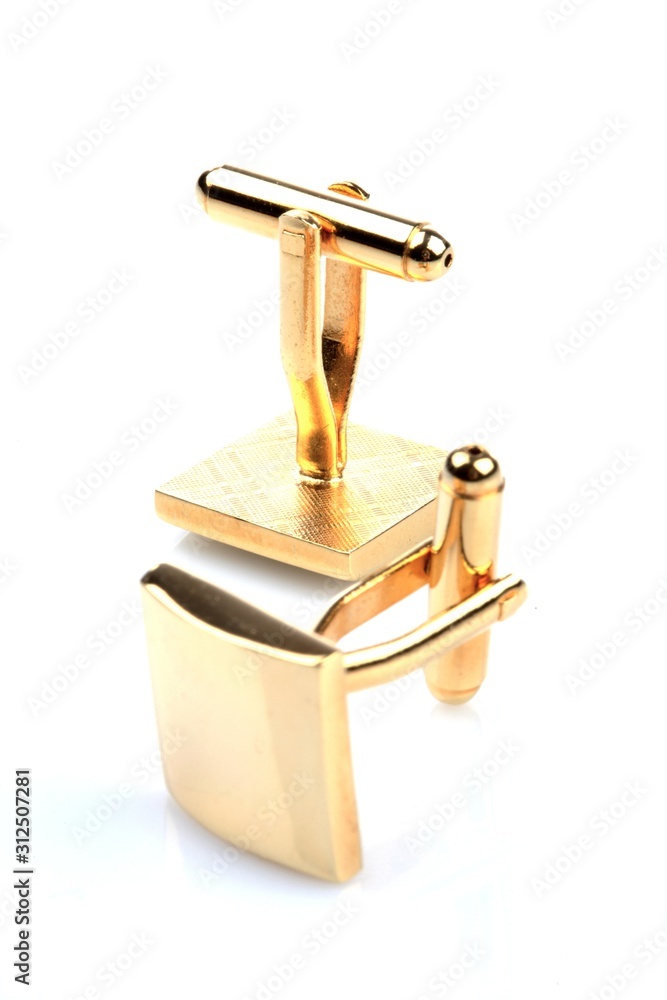 Gold cuff links on white background Gold cuff links on white background