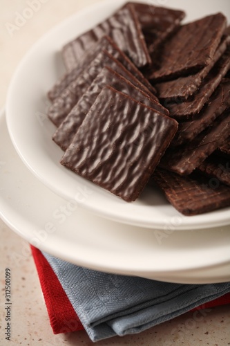 Chocolate cookies on white plate
