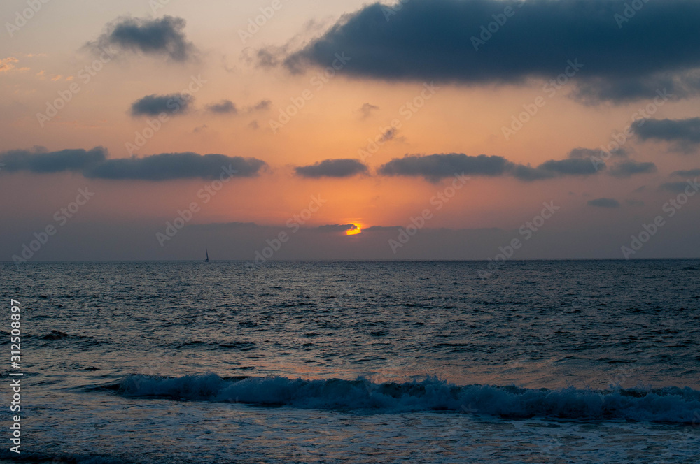 The sun rolling over the horizon in the sea