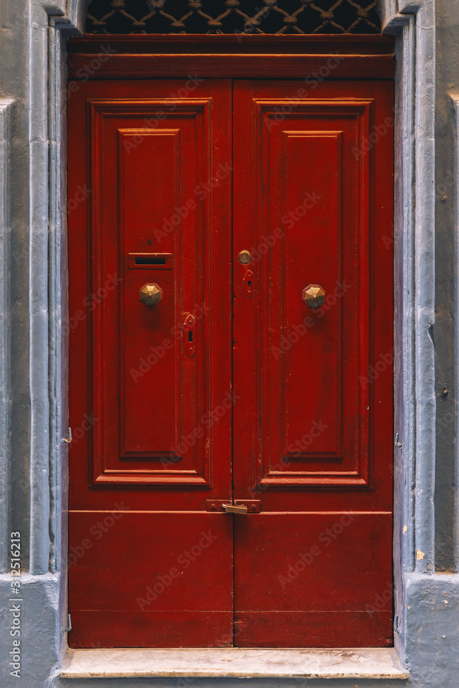 Old vintage weathered wooden door of Malta