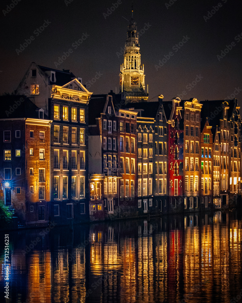 Naklejka premium reflections in Amsterdam canals at night long exposure