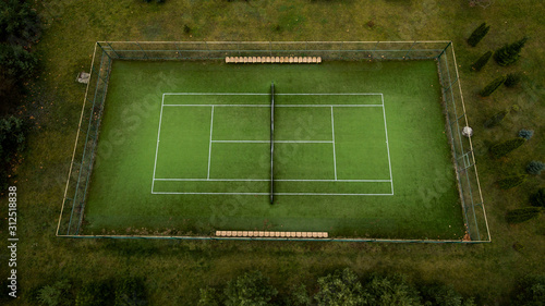 Photo of a tennis green field from a height.