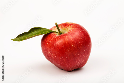 red apple with leaf isolated on white