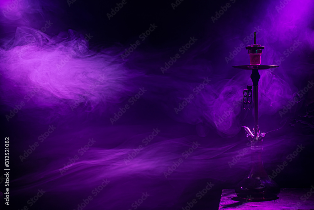 The classic hookah. Beautiful background, with colored rays of light and smoke. The concept of hookah Smoking. - obrazy, fototapety, plakaty 