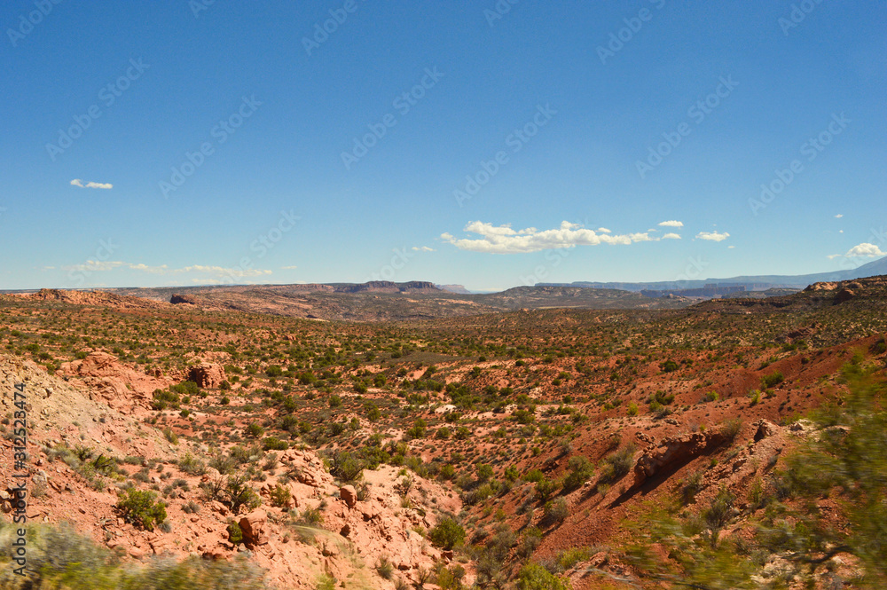 Spectacular panoramic view from viewpoint into desert and mountains near Capitol Reef and Arches national park