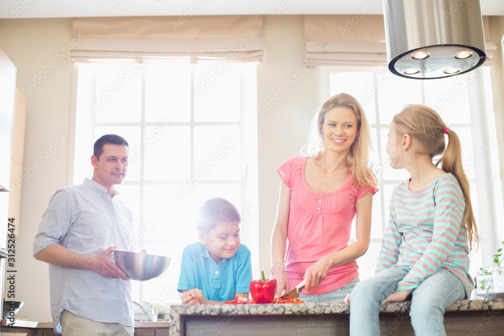 Fototapeta premium Family preparing food in kitchen