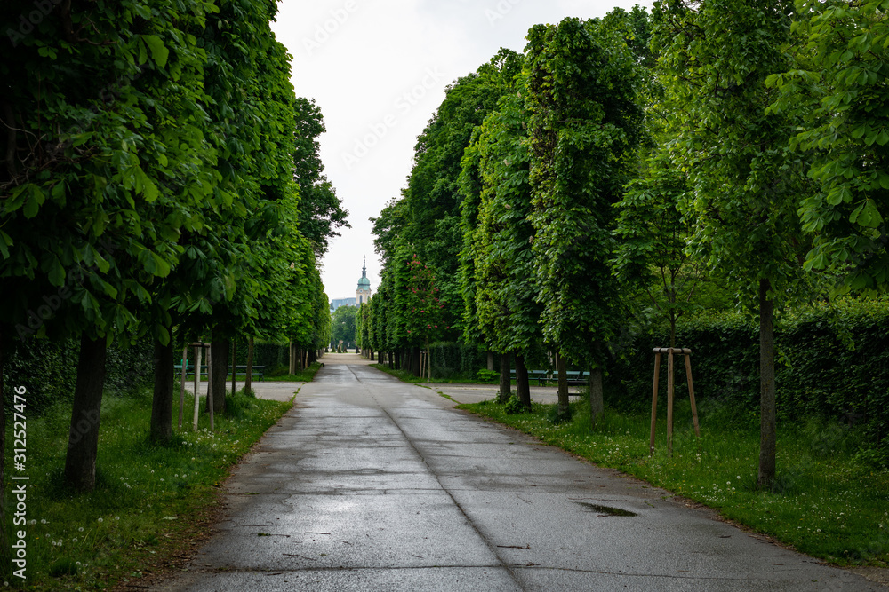 Avenue in Augarten Park in Vienna on a cloudy day in spring