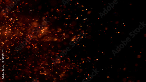 Burning red hot sparks fly from large fire in the night sky. Beautiful abstract background on the theme of fire, light and life. Burning embers glowing flying away particles over black background.